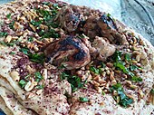 Traditional musakhan eaten in Azzun