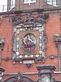 Detail with relief of Dordrecht maiden surrounded by city shields, sculpted by Gillis Huppe