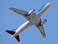 The swept wing planform of a BMI British Midland Airbus A319-100, seen at take off