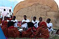 Image 42Somali men and women in front of a traditional house (from Culture of Somalia)