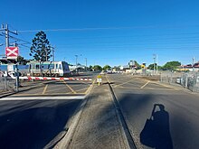 Level crossing with a train crossing through