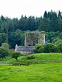 Penninghame Home Farm. View across fields to the south of the farm towards the remains of Castle Stewart