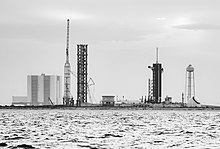 Large steel tower next to the Vehicle Assembly Building