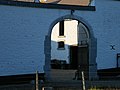 Farmyard doorway with guard stones in Belgium