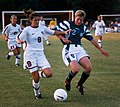 Image 13Mia Hamm (left) battles with German defender Kerstin Stegemann (from Women's association football)