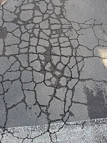 Fatigue cracking in asphalt pavement.