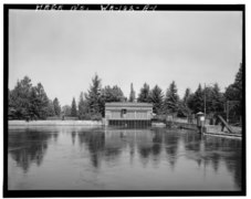 Gate house above the power plant with the diversion channel in the foreground