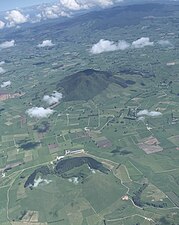 View to west of Te Kawa tuff ring (foreground), Kakepuku (middle distance) and Pirongia in distance