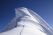 Giant cornice on top of the Chopicalqui (6.345 m) in the Andes in Peru