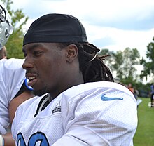 Bill Bentley from the side, from about the shoulders up, wearing a Detroit Lions jersey.