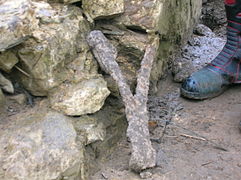 An old iron stone block binding. These expanded as they rusted and ironically led to the loosening of the stonework.