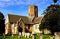 Uffington Church from the SE showing 6-sided central tower and side door in South transept