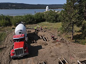 Crews pour concrete footings, the first step in the construction of a permanent home of the NSF’s SOLIS instrument at Big Bear Solar Observatory in California