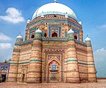 A mausoleum decorated with blue and green tiles