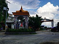 statue and entrance gate at Ramagrama stupa