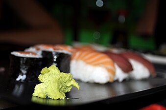 Wasabi paste on a plate of sushi