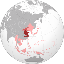 The Wang Jingwei regime (dark red) and Menchiang (light red) within the Empire of Japan (pink) at its furthest extent