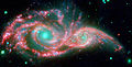 Una imagen en infrarrojos por el Spitzer de NGC 2207 e IC 2163.