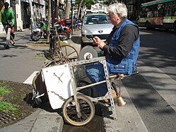 Scissors grinder with a "modern grinding cart" in Paris, 2008