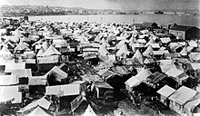 Crowded tent camp stretching out a long distance