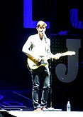 Mendes performing with a guitar