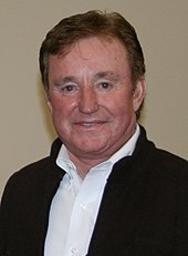 Richard Childress wearing a shirt with the first button undone and a black full-zip fleece