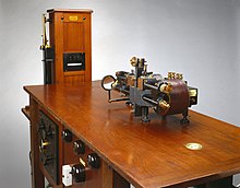 Electrocardiograph, a large wooden, workbench-like machine, with metal switches on the front face