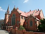 The external detail is Gothic. The fine red brick is typically 'Church and McLauchlin'. During the early 19th century, the Methodist congregation was supported by a group of people willing Type of site: Church Current use: Religious: Church. As a historical landmark in Kimberley, the Trinity Methodist Church complex is of compact design.