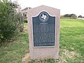 Historic marker at site of a former hotel