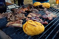 Bulz and pastramă on a grill