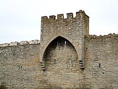 A small tower riding on the wall west of the South Gate