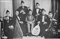 Image 18Iraqi music group led by Yusuf Za'arur in Baghdad, wearing the sidara, ca 1930. (from Music of Iraq)