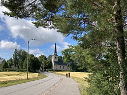The church village of Degerby. The church building from 1932 in the background.