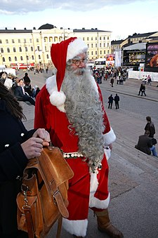 Muž oblečený jako Joulupukki v Helsinkách (čeština)