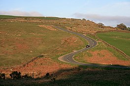 road snaking up a hill