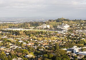 Maungakiekie / One Tree Hill, Cornwall Park, Alexandra Park and Greenlane Clinical Centre and suburban Epsom houses seen from Maungawhau / Mount Eden