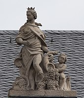 9. Weinbau – Putto, Füllhorn, Trauben, Weinpresse.