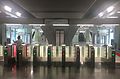 Fare gates leading out of the paid area of the concourse level.