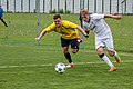 Souboj o míč mezi hráči klubů FK Kozlovice (ve žlutém) a SK Dětmarovice (2019), Dětmarovice