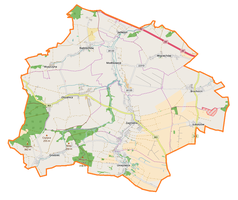 Mapa konturowa gminy Zagrodno, u góry nieco na lewo znajduje się ikonka zamku z wieżą z opisem „Ruina zamku w Radziechowie”