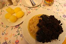 Baked blood with sauerkraut and potatoes