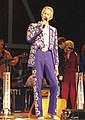 Porter Wagoner wearing elaborate Nudie suit