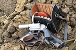 Flare gun with holster and cartridges in leather case displayed at a World War II reenactment event in 2011