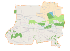 Mapa konturowa gminy Komarów-Osada, w centrum znajduje się punkt z opisem „Komarów-Osada”