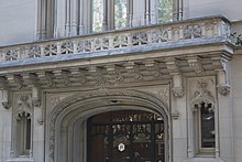 The top of the arch and the balcony over the main entrance of the Warburg House