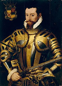 Portrait of the 10th Earl of Ormond in a black-and-gold armour holding a wheellock pistol, with his coat of arms at upper left. He has brown eyes and short black hair, with a reddish-brown mustache and beard.