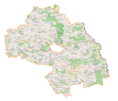 Mapa konturowa powiatu chełmskiego, blisko centrum na prawo znajduje się punkt z opisem „Wólka Okopska”