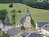 Sint-Martinuskerk, kerkhofmuur en pastorie; daaraan palende watermolenruïne (monument) het geheel gevormd door deze monumenten en hun omgeving, de grotten van Crons (site)