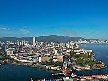 Aerial view of the city centre of George Town, situated at a cape flanked by the sea.