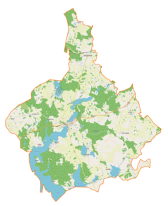 Mapa konturowa gminy Ryn, blisko centrum na lewo znajduje się punkt z opisem „Ryn”